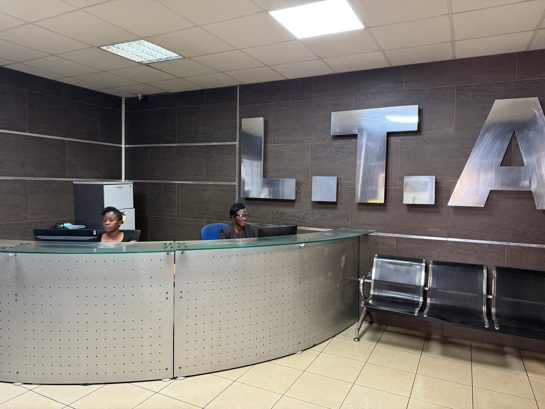 Reception desk at the Lagune Transit Abidjan head office, beneath the L.T.A lettering