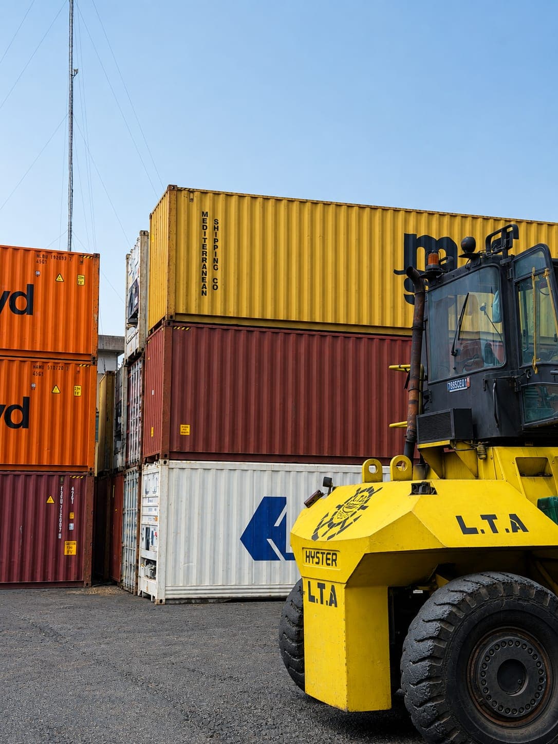 LTA forklift at the foot of a stack of containers
